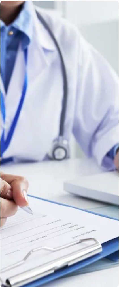 Doctor completing a patient form